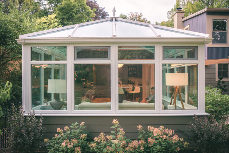 A glass sunroom addition on a home